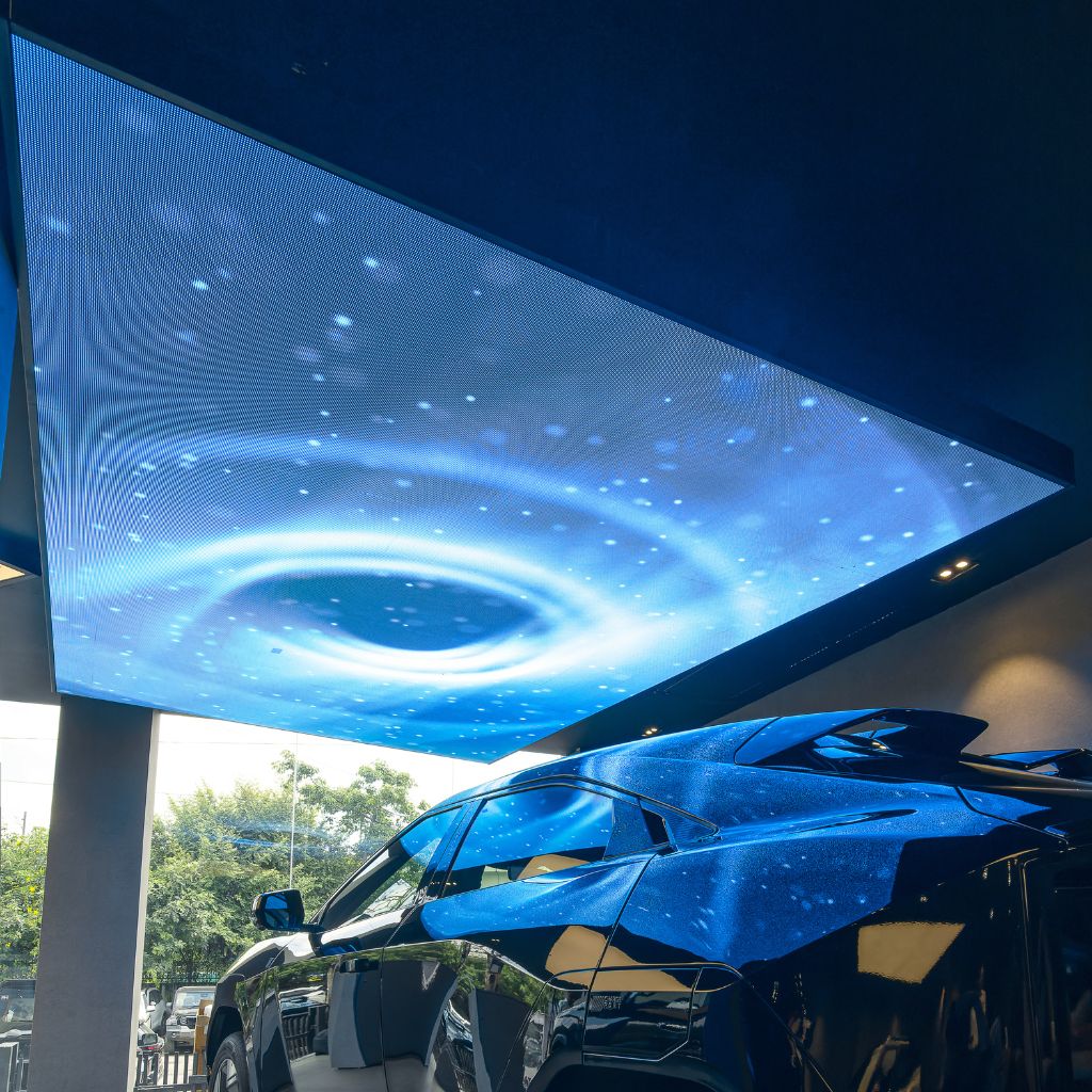 Aleda LED ceiling display above a car showroom