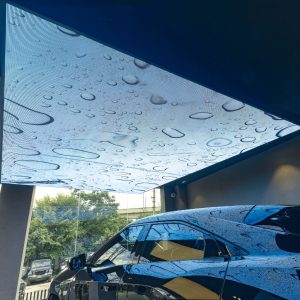 Aleda LED digital ceiling panel over a car.