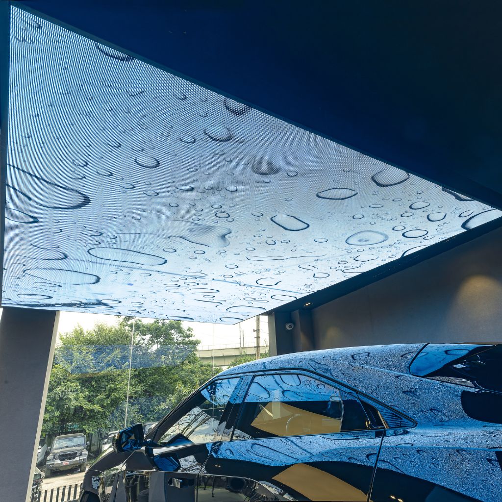 Aleda LED digital ceiling panel over a car.